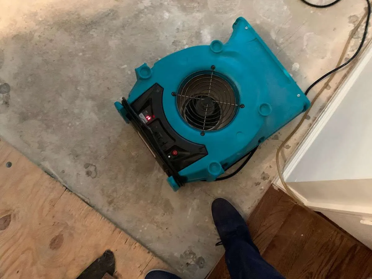 Air mover drying subfloor during Leak Detection & Repair in Fayetteville